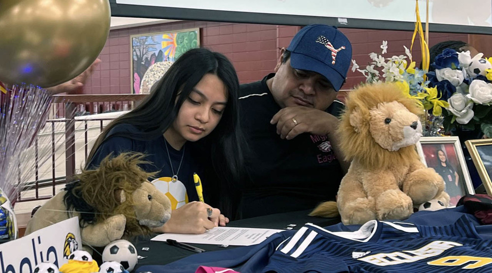 Student athlete Thalia Rae Hernandez Astello of Springdale High School signs a ceremonial letter of intent Feb. 8 to play soccer for Ecclesia College in her hometown of Springdale.